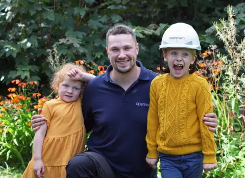 Openreach man and children