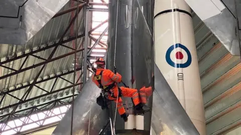 Worker at the RAF Cosford museum