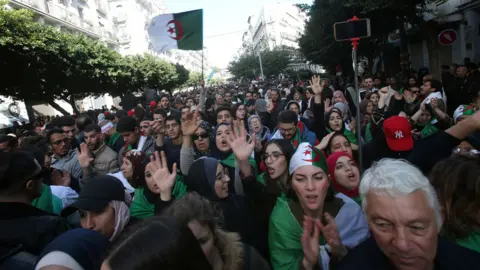 Reuters Demonstrators shout slogans during a protest to reject the presidential election in Algiers, Algeria December 12, 2019