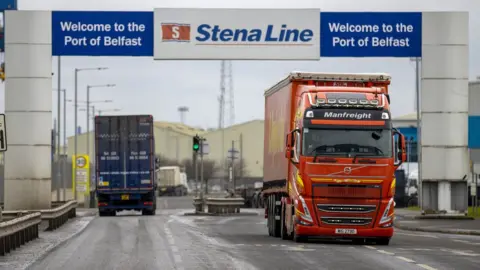 Liam McBurney/PA Media Freight lorries travelling through the Port of Belfast (archive photo)