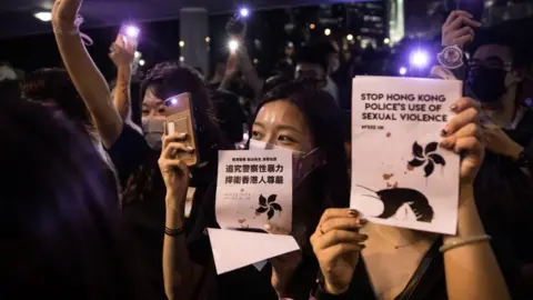 iStock Protester holding up signs 'stop Hong Kong police's use of sexual violence'