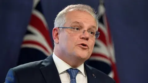 EPA Australian Prime Minister Scott Morrison speaks at a news briefing in Sydney. Photo: 15 March 2020