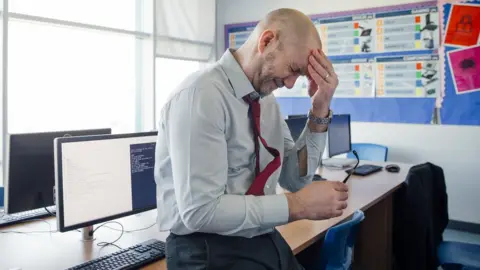 Getty Images Stressed teacher