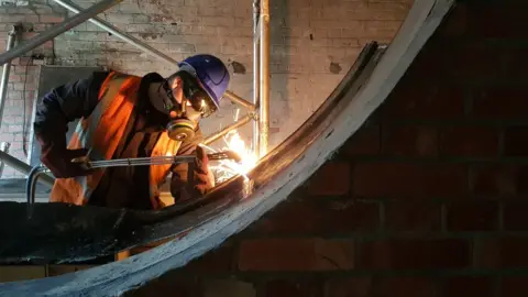 Bristol Music Trust Worker welding at Colston Hall