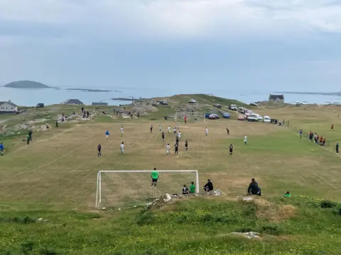 Steve Broughton The Eriskay football pitch, overlooking the sea.