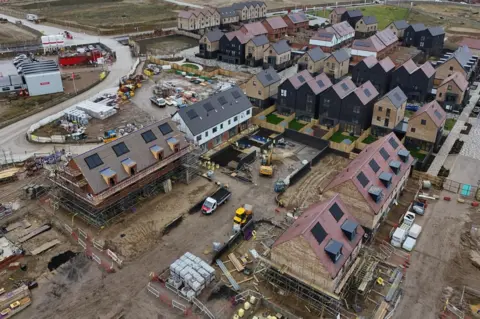 EPA An image made with a drone shows houses under construction in the Garden City of Ebbsfleet, Britain, 20 February 2025.