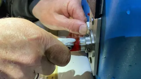 Environment Agency A salmon smolt being tagged