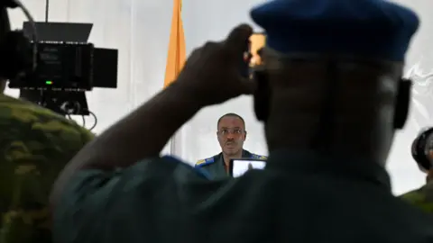 AFP Ivorian army officer Colonel Armand Guzoa Mahi addresses the press at the army headquarters in Abidjan, Ivory Coast - Wednesday 13 July 2022