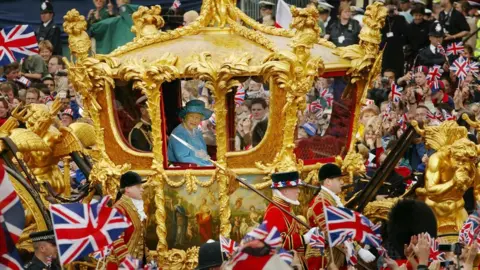 Getty Images The Queen rides in the Golden State carriage during her Golden Jubilee in 2002