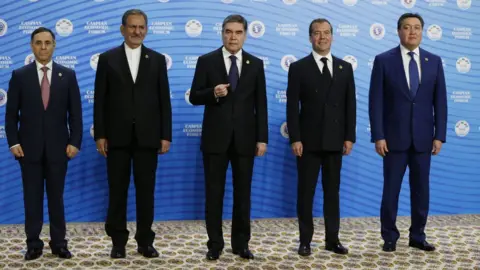 EPA Mr Berdymukhamedov, centre, posing next to Azeri prime minister Novruz Mammadov, Iranian vice president Eshaq Jahangiri, Mr Medvedev, and Kazakh prime minister Askar Mamin at the Caspian Economic Forum