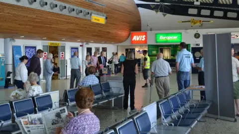 Christopher Quevatre People waiting in Guernsey airport