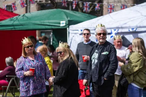 Getty Images people celebrate in ballater