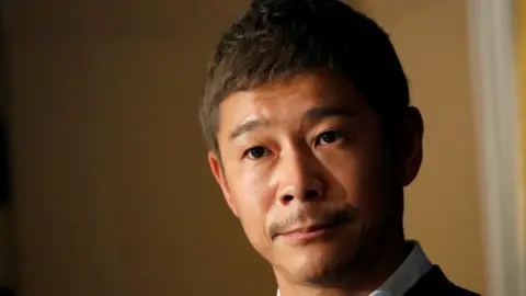 Reuters Japanese billionaire Yusaku Maezawa