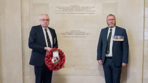 Ulster Unionist Party Steve Aiken and Doug Beattie laid a wreath under a memorial to Sir Norman at Stormont