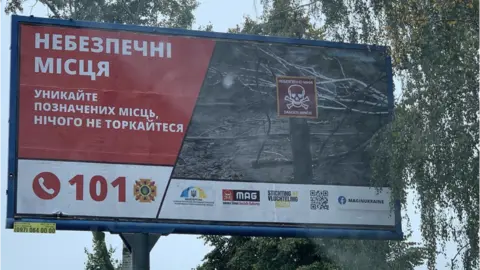 Mines Advisory Group MAG billboard in Ukraine warning citizens of danger of mines