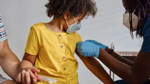 Getty Images A file image of a child receiving a vaccine