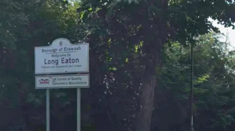 Google Sign which reads Long Eaton with trees behind the sign