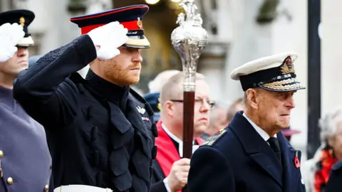 Getty Images Prince Harry and Prince Philip at the Fields of Remembrance at Westminster Abbey in 2016