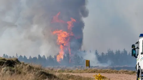 Jasper Image burning heather and woodland near Dunphail, Forres