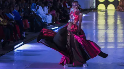 Marta Moreiras Senegalese model Alima Diop poses on the catwalk wearing a design by Algaye during Dakar Fashion Week in Dakar, Senegal