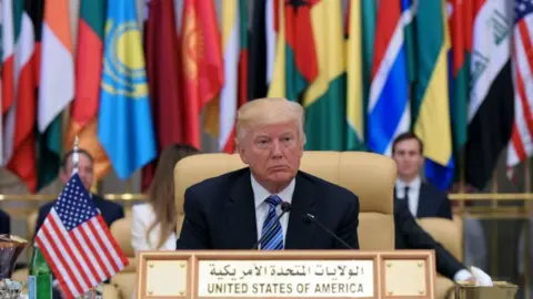 MANDEL NGAN VIA GETTY IMAGES US President Donald Trump is seated during the Arab Islamic American Summit at the King Abdulaziz Conference Center in Riyadh in 2017