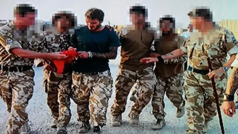 BBC David Beckham with Omar and British troops in Afghanistan