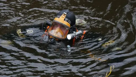 Peter Byrne/PA Police diver