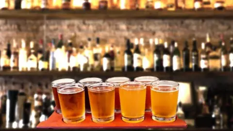 Getty Images Tray of beers in a pub