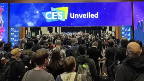 BBC News The entrance to the CES Unveiled Event, with many people crowding to enter