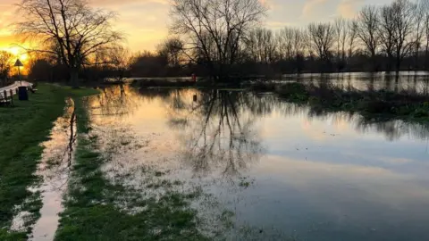 BBC/Adrian Harms Water breached the banks of the River Thames in Chertsey