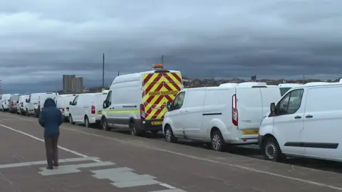 BBC White vans parked on New Brighton promenade