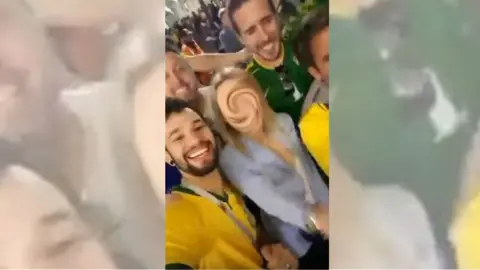 Empics Woman's face blurred out, surrounded by men