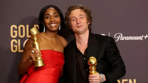 MARIO ANZUONI Ayo Edebiri and Jeremy Allen White clutching their Golden Globes