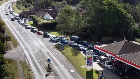 PA Media Motorists queuing for fuel on 29 September