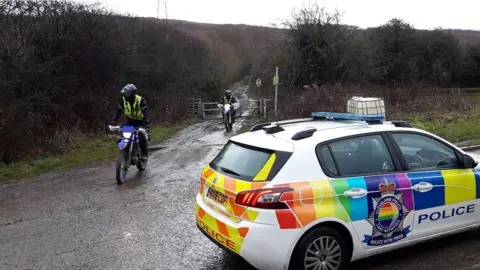 Cleveland Police Cleveland Police car with two officers on off-road bikes