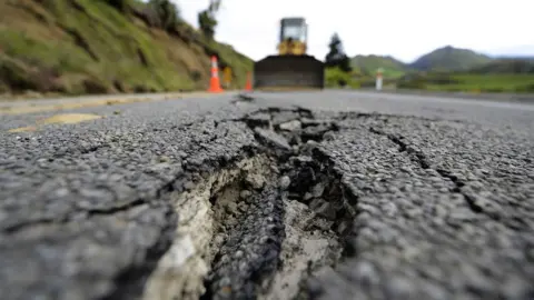 Getty Images Crack in a tarmac road