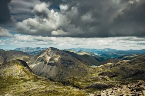 Getty Images hills and clouds as seen from the top of Scafell Pike