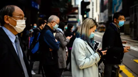 Getty Images People wearing masks in Hong Kong