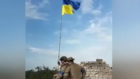 Ukraine flag being raised