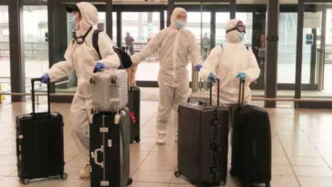 Getty Images hazmat suits Gatwick