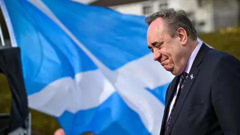 Alex Salmond in front of a saltire 