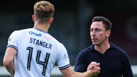 Scott brown shakes hands with George Stanger of Ayr