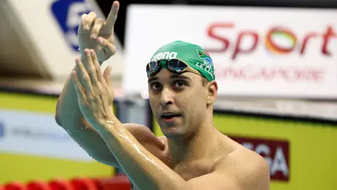 Getty Images Chad le Clos of South Africa celebrates after winning the men’s 200m butterfly final during day two of the World Aquatics Swimming 2024 World Cup in Singapore.