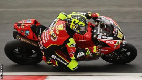 Getty Images Shane Byrne on a motorbike