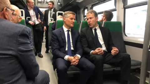 Mark Harper and Dan Norris on the first new train to Portway station