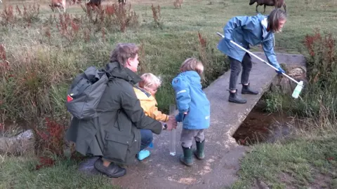 BBC Family taking part in water testing