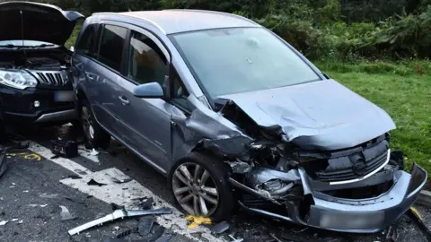 Nottinghamshire Police Several cars were involved in the crash at the junction of Coxmoor Road, near Annesley, in Nottinghamshire