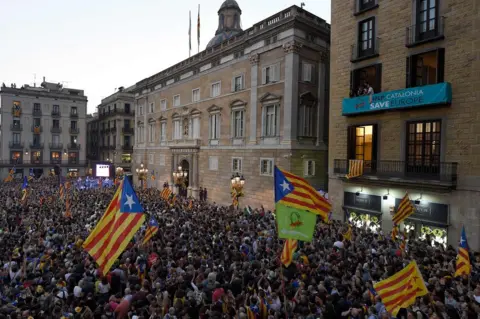 AFP People gather to celebrate the proclamation of a Catalan republic on Sant Jaume Square in Barcelona, 27 October