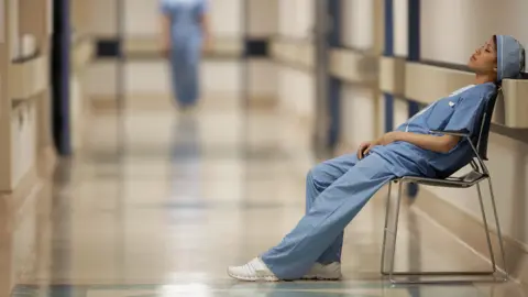 Getty Images exhausted staff