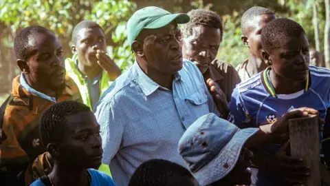 Duncan Moore Gerald Ashiono, chairman of the local Bull Owners Welfare group, looks on at a bull fight in western Kenya